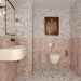 Contemporary bathroom featuring Vito Moonstone terrazzo effect porcelain wall and floor tiles in 60cm x 120cm. Large-format terrazzo style tiles are paired with Sylvester Pink honed natural marble wall tiles, creating a warm, elegant space with brass fittings and modern fixtures.