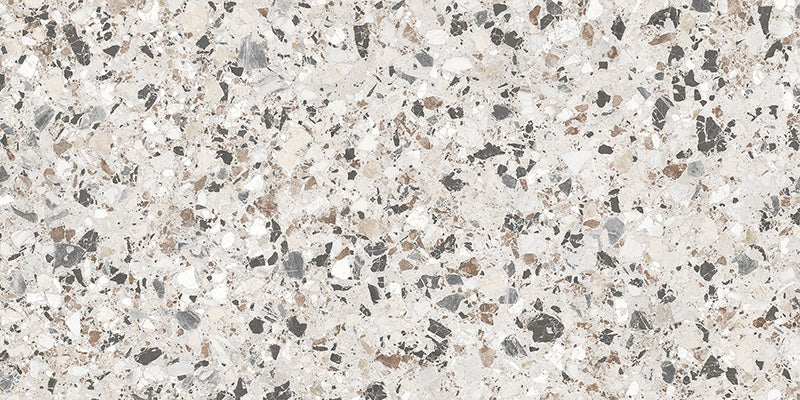 Close-up of the Vito Moonstone 60x120cm terrazzo style porcelain tile, featuring a soft light grey base with a blend of white, silver, charcoal and taupe stone fragments. The realistic 4D brushed finish enhances the texture and depth, creating an authentic terrazzo effect.