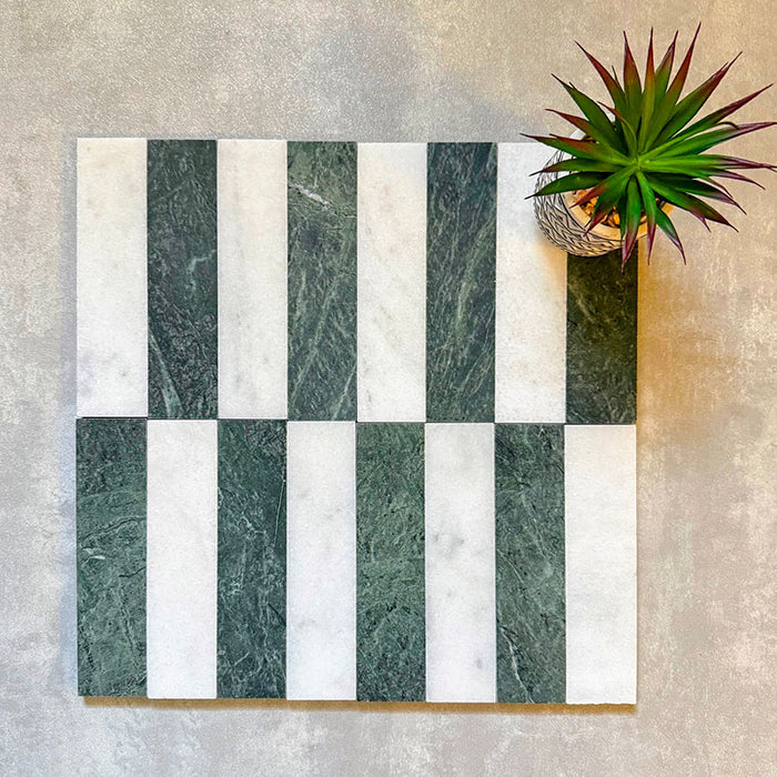 Fitzrovia Verde 5 x 20cm honed natural marble tiles arranged in a vertical striped layout, combining deep green marble with soft white tones to create a clean, balanced contrast, highlighting the natural variation and linear design potential of the collection.