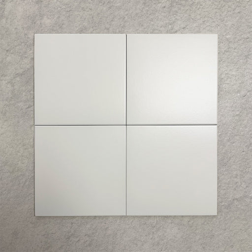 Four Chessboard White 25×25cm Victorian-style porcelain tiles arranged in a square to show colour consistency, smooth satin finish, and overall appearance, displayed against a light textured background.