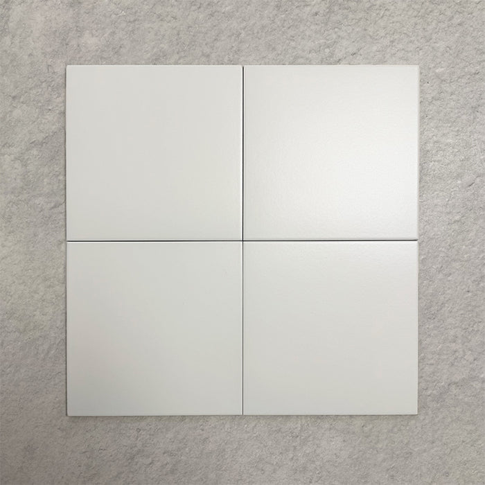 Four Chessboard White 25×25cm Victorian-style porcelain tiles arranged in a square to show colour consistency, smooth satin finish, and overall appearance, displayed against a light textured background.