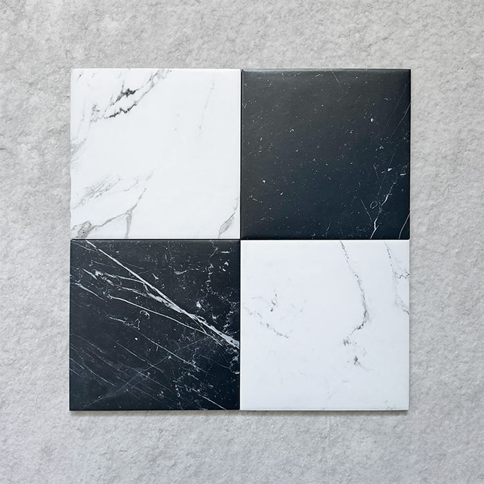 Four Calacatta Blanca White marble-effect 25×25cm porcelain tiles displaying natural grey veining variation, ideal for creating an authentic marble look across floors and walls in contemporary and classic interiors.