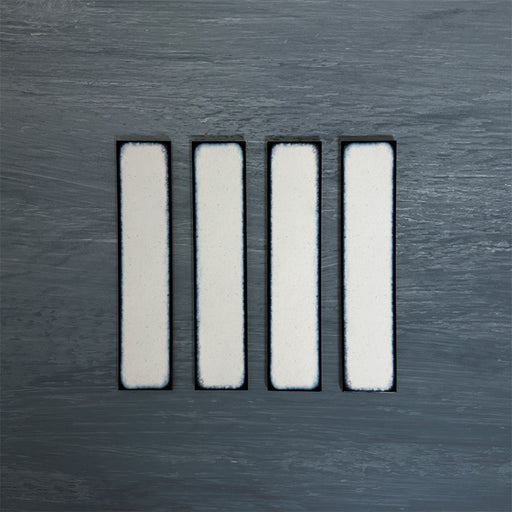 Group of Chemistry White 6.5cm x 30cm rectangular ceramic wall tiles, showcasing a glossy crackle-effect white glaze with subtle tonal variation and an artisan handcrafted effect finish.