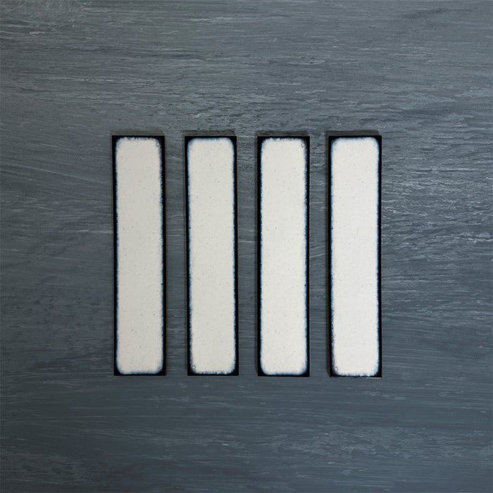 Group of Chemistry White 6.5cm x 30cm rectangular ceramic wall tiles, showcasing a glossy crackle-effect white glaze with subtle tonal variation and an artisan handcrafted effect finish.