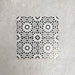 Fizaan Winter Mini Moroccan-style 15×15cm porcelain tiles laid in a repeating geometric pattern, featuring a black and white star motif.