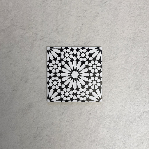 Fizaan Winter Mini Moroccan-style 15×15cm porcelain tile featuring a bold black and white geometric star pattern.