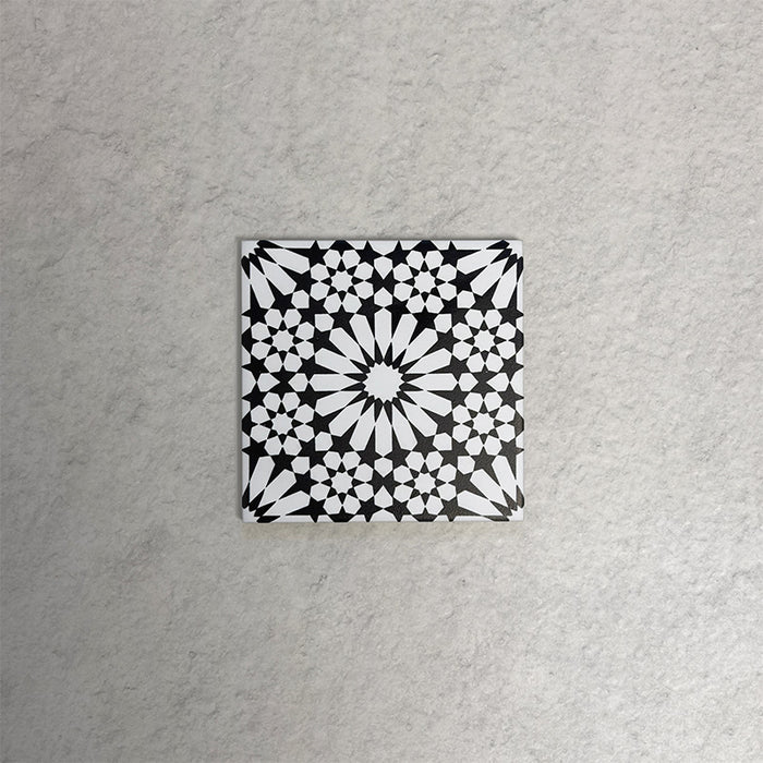 Fizaan Winter Mini Moroccan-style 15×15cm porcelain tile featuring a bold black and white geometric star pattern.