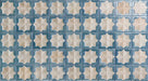 Close-up of Zeina Moroccan Arena Blue ceramic wall tiles featuring a Moroccan style geometric star pattern in soft cream and muted blue with a glossy finish, subtle shade variation and an aged handcrafted look for feature walls and splashbacks.