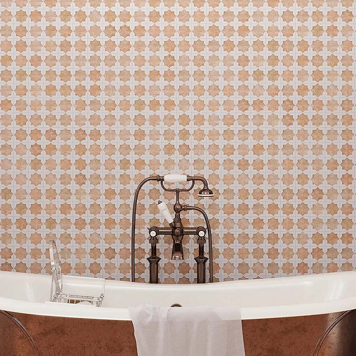 Bathroom featuring Zeina Moroccan Cotto White ceramic wall tiles in a repeating Moroccan style geometric pattern, paired with a freestanding copper bath, terracotta effect floor tiles, arched window, woven pendant light and olive trees for a warm Mediterranean-inspired retreat.