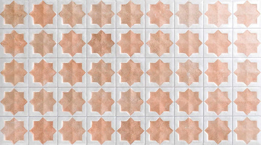 Close-up of Zeina Moroccan Cotto White ceramic wall tiles featuring a repeating Moroccan style geometric star pattern in warm terracotta and crisp white tones, with a glossy glazed finish, subtle shade variation and handcrafted-inspired character.