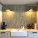 Customer kitchen featuring Zellij Weald Green Brick 6.5cm x 20cm Moroccan style tiles across the splashback, with soft tonal variation, white cabinetry, a Belfast sink and warm brass fixtures.