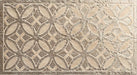 Close-up of Ziza Sandy Beach Moroccan style decorative porcelain wall tile, featuring an intricate carved geometric floral pattern in soft sandy beige and taupe tones with textured engraved detailing and a gently aged finish, perfect for creating statement bathroom walls, kitchen splashbacks and feature walls with timeless Moroccan-inspired character.