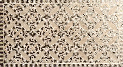 Close-up of Ziza Sandy Beach Moroccan style decorative porcelain wall tile, featuring an intricate carved geometric floral pattern in soft sandy beige and taupe tones with textured engraved detailing and a gently aged finish, perfect for creating statement bathroom walls, kitchen splashbacks and feature walls with timeless Moroccan-inspired character.