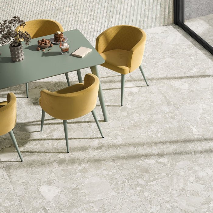 Contract Pebble Rock Blanca 60x120 porcelain floor tiles in dining area, light stone-effect surface with soft natural variation