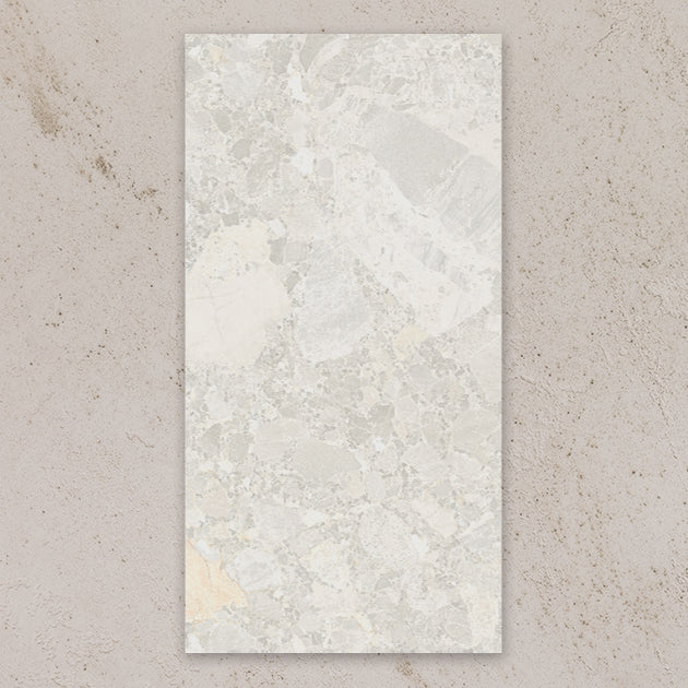 Contract Pebble Rock Blanca porcelain tile 60x120, stone-effect design with layered pebble fragments in light ivory and grey shades