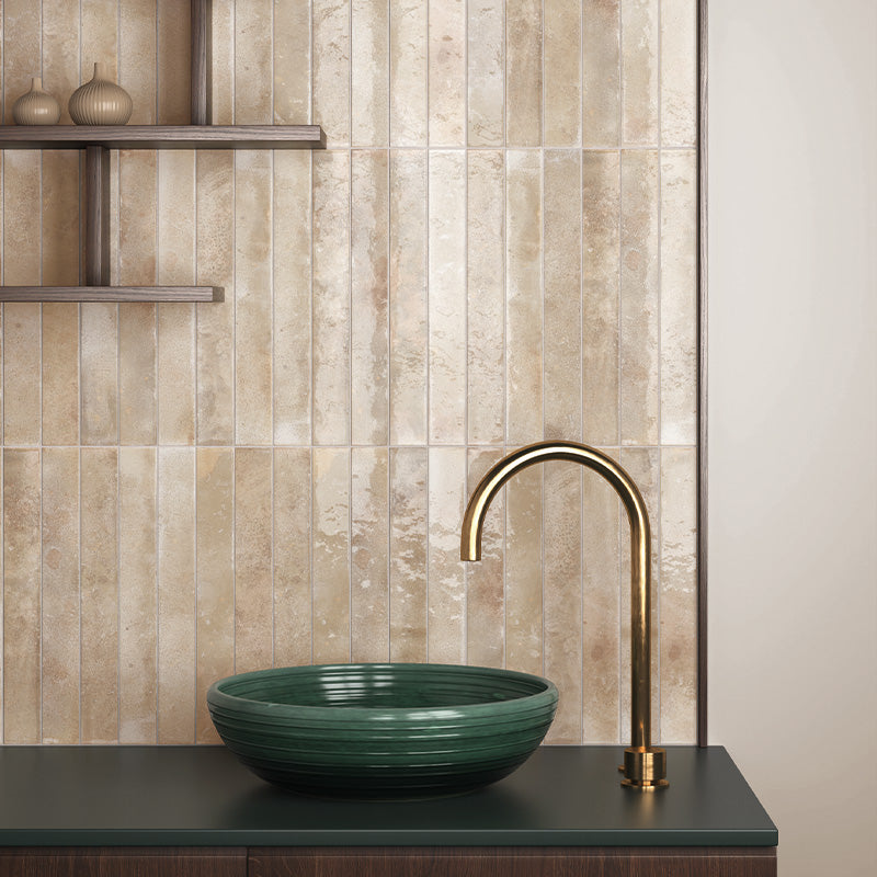 Vertical almond gloss wall tiles behind a vanity unit, highlighting warm beige tones and a light-reflective finish.