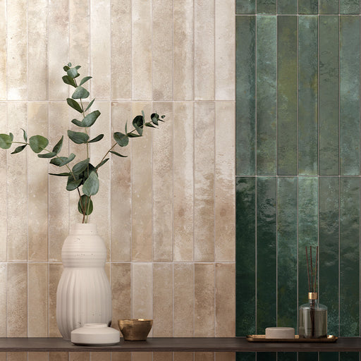 Vertical almond gloss wall tiles paired with pine green tiles, creating a warm bathroom setting with soft neutral tones.