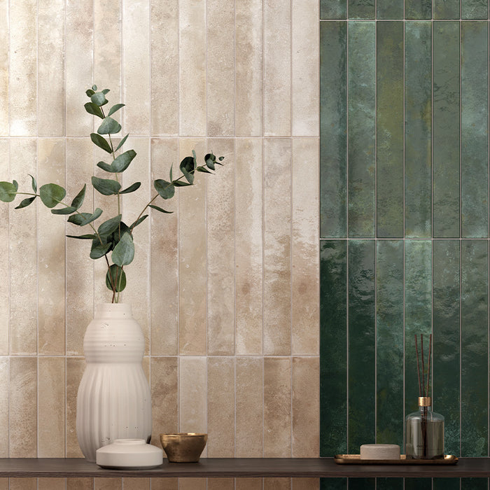 Vertical almond gloss wall tiles paired with pine green tiles, creating a warm bathroom setting with soft neutral tones.