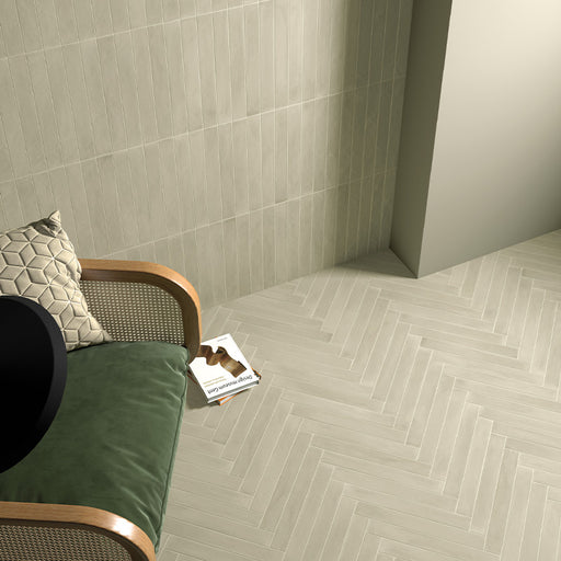 Maldives Jade Green 5x40 wall and floor tiles in a herringbone layout, featuring warm green tones and natural surface variation.