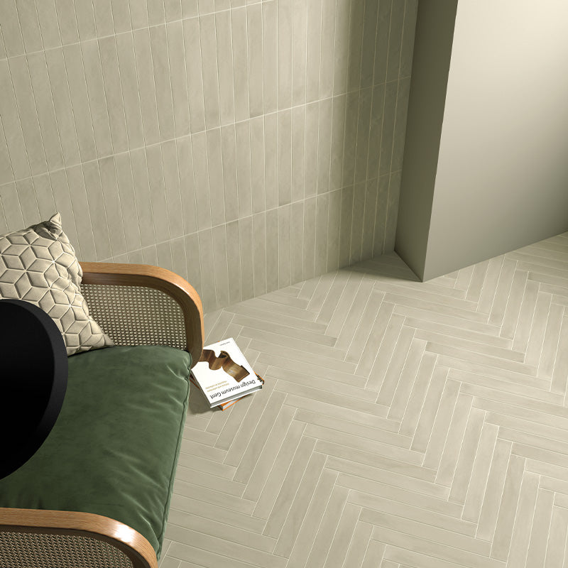 Maldives Jade Green 5x40 wall and floor tiles in a herringbone layout, featuring warm green tones and natural surface variation.