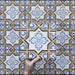 Video showcasing the Carnaby Maestro Victorian Style porcelain tiles in a 20×20cm size, featuring a detailed blue and terracotta geometric floral pattern on a soft white background. The footage highlights the matt finish, intricate Victorian-inspired design, and how the repeating pattern looks across multiple tiles.