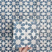 Video showcasing Soukaina Blue C Moroccan-style 20cm x 20cm patterned porcelain tiles, highlighting the repeating geometric star design, rich blue and neutral colour palette, and matt finish when laid together.