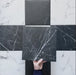 Video showcasing Calacatta Nero Black marble-effect 25×25cm porcelain tiles, highlighting the deep black base, striking white veining variation, and suitability for bold, elegant floors and walls in modern and classic interiors.