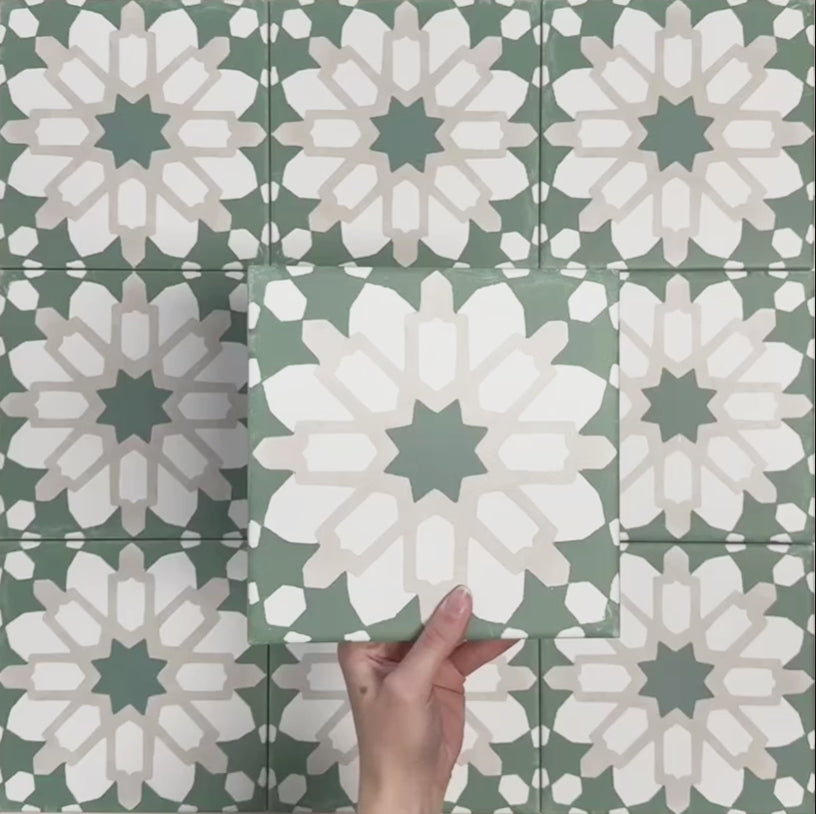 Video showcasing Soukaina Green D Moroccan-style 20cm x 20cm patterned porcelain tiles, highlighting the bold central star design, soft green and neutral colour palette, and matt finish when laid together.