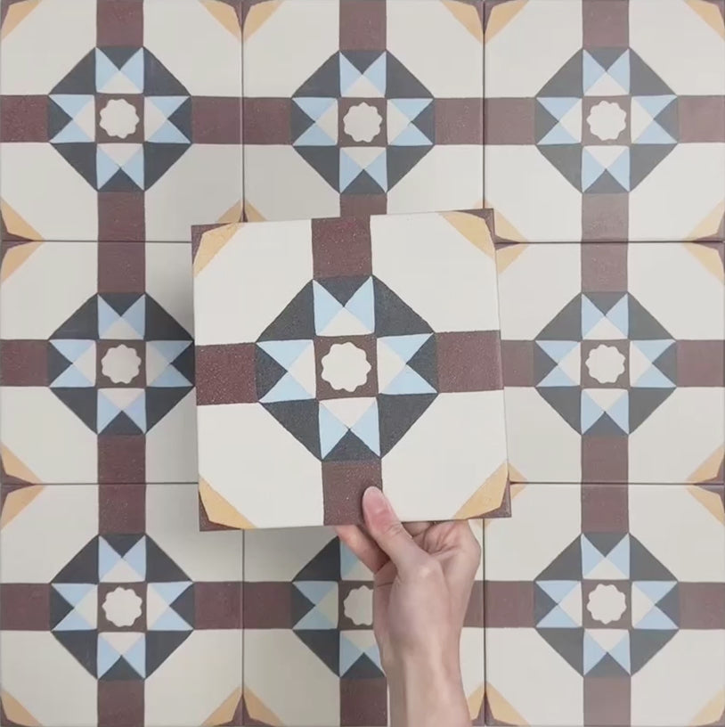 Video showcasing Europa Berlin 20x20cm Victorian Moroccan style tiles arranged together to showcase the repeating geometric star pattern in burgundy, blue, mustard and cream tones.