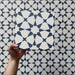Video showcasing Agraba Navy 20x20cm Moroccan-style ceramic tiles, highlighting their bold navy blue and white geometric star pattern with a smooth matt finish under natural light.