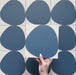Pebble Beach Reversed Blue 20x20cm patterned tiles featuring a bold deep blue organic circular design, ideal for creating playful statement walls and contemporary patterned floors with a modern geometric feel.