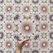 Video showcasing Cabana Manzanillo Moroccan Style 20x20cm porcelain tile featuring a geometric starburst pattern in blush pink, mustard, terracotta, lilac, and turquoise tones, highlighting its matt finish and intricate repeating design.