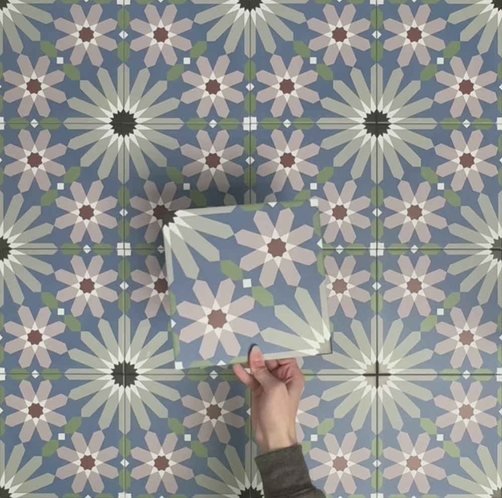 Video showcasing Fizaan Artisan Moroccan-style 20×20cm porcelain tiles, highlighting the blue, green and soft pink geometric floral pattern and surface detail.