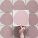 Pebble Beach Reversed Pink 20x20cm patterned tiles featuring a soft blush pink organic circular design, perfect for adding a playful yet minimalist look to bathrooms, kitchens, and statement floors.