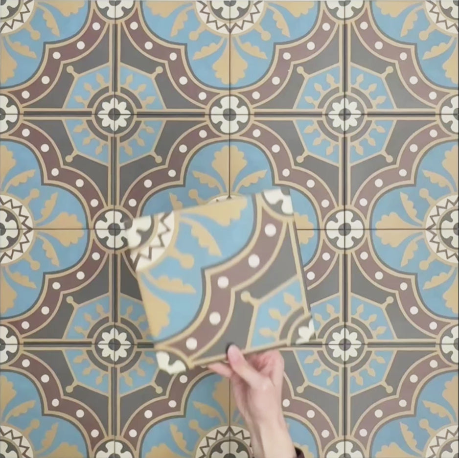 Video showcasing Europa Hanover 20x20cm Victorian Moroccan style tiles arranged together to showcase the repeating decorative pattern in blue, terracotta, mustard and cream tones.