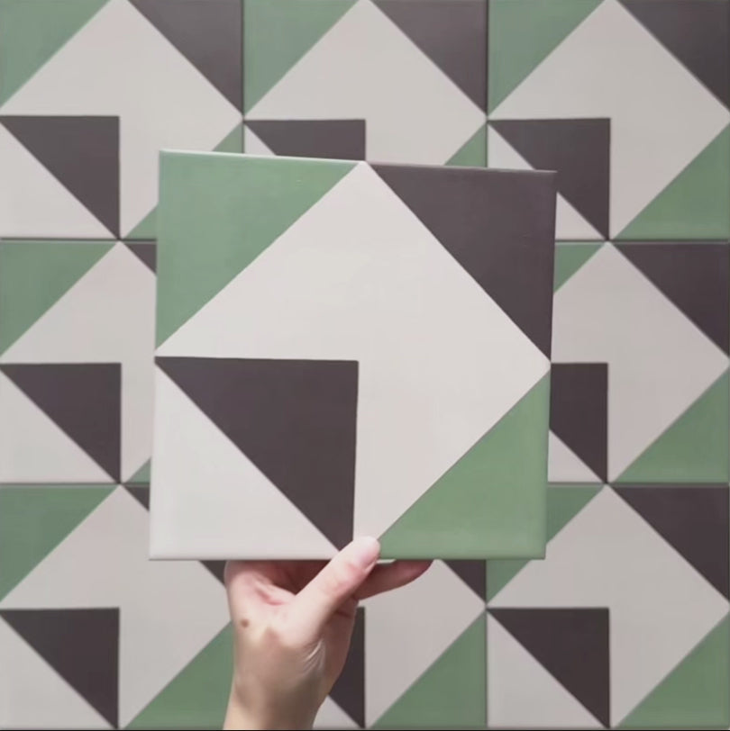 Video showcasing the Geometry Angles Patterned Tile in a 20cm x 20cm format, featuring close-up pans and angled shots of the green, white, and black geometric design, highlighting the crisp triangular pattern, matte finish, and overall layout of the tiles.