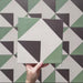 Video showcasing the Geometry Angles Patterned Tile in a 20cm x 20cm format, featuring close-up pans and angled shots of the green, white, and black geometric design, highlighting the crisp triangular pattern, matte finish, and overall layout of the tiles.