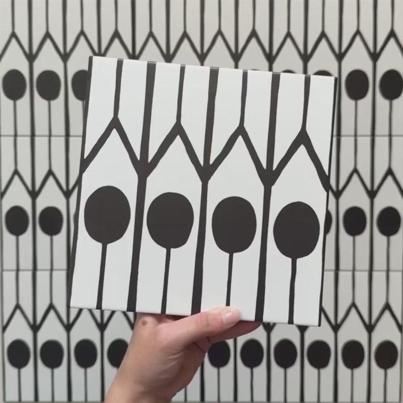 Alhambra Felisa 20x20cm Moroccan tile video showcasing the tile’s bold black and white design with teardrop motifs and vertical lines, highlighting its intricate pattern and smooth matte finish.