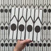 Alhambra Felisa 20x20cm Moroccan tile video showcasing the tile’s bold black and white design with teardrop motifs and vertical lines, highlighting its intricate pattern and smooth matte finish.