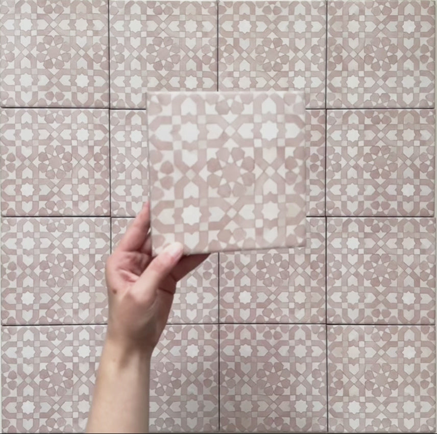 Video showcasing Bedouin Tetuan Rose Moroccan-style 15x15cm tiles, featuring a soft blush pink and white geometric pattern with a handcrafted matte finish. The clip highlights the tile’s intricate Moroccan-inspired design, delicate texture, and subtle colour variation under natural light.