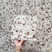 Video showcasing Dino Terrazzo Blanco Drops 20x20cm terrazzo-style ceramic tiles, highlighting the surface texture, large stone-effect chips, and natural matte finish under shifting light.