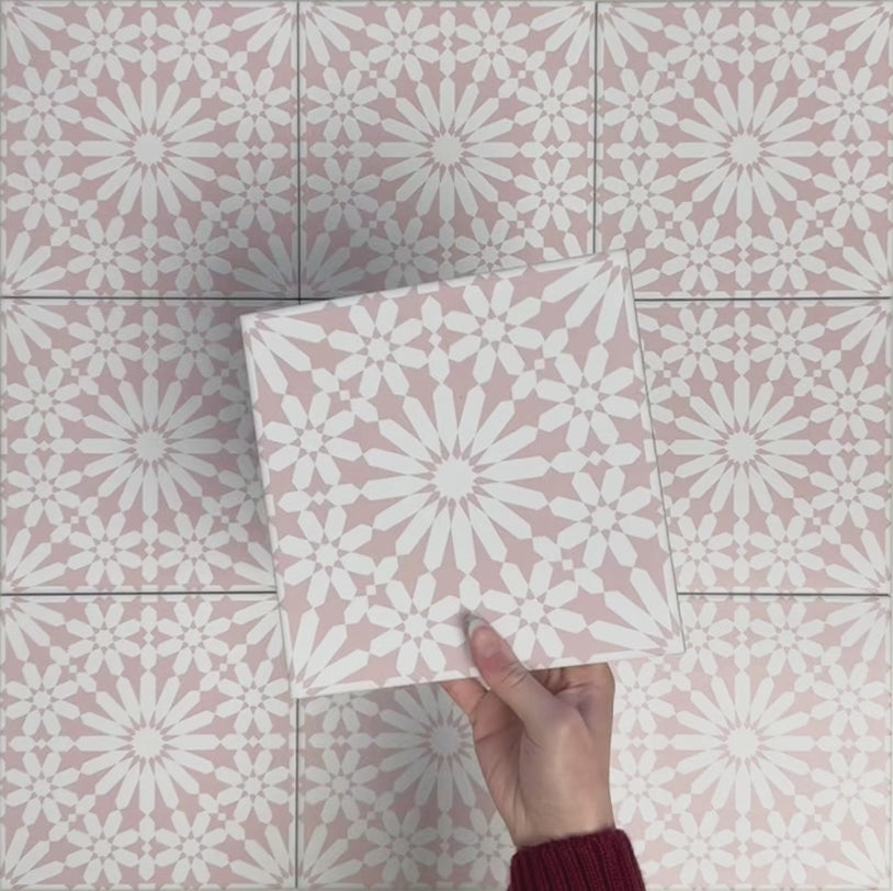 Video showcasing Fizaan Pink Rose 20x20cm Moroccan-style porcelain tiles, highlighting the repeating geometric pattern and soft pink and white tones in close-up detail.