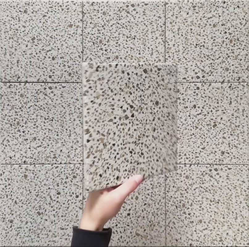 Video showcasing Dino Terrazzo Blanco Dots 20x20cm terrazzo-style ceramic tiles, highlighting the surface texture, natural stone speckle detailing, and matte finish under changing light.