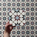 Video showcasing Agraba Mini Atlas 15x15cm Moroccan-style ceramic tiles, highlighting their multicoloured geometric star pattern in blue, terracotta, and white with a smooth matt finish under natural light.