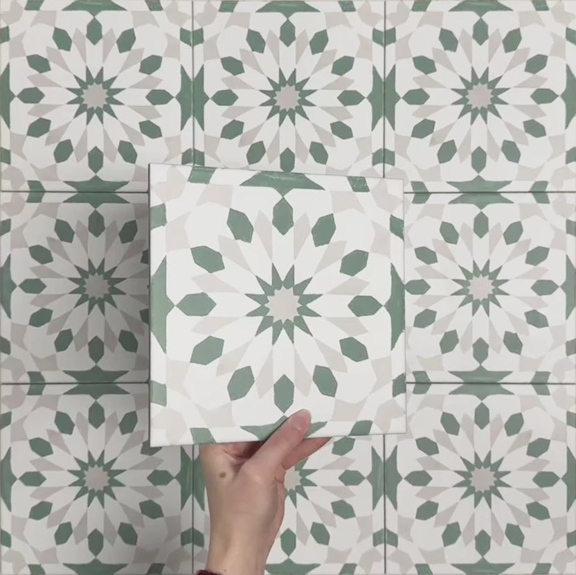 Video showcasing Soukaina Green A Moroccan-style 20cm x 20cm patterned porcelain tiles, highlighting the soft green and white geometric designs, matt finish, and how the repeating pattern flows when laid together.