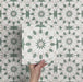 Video showcasing Soukaina Green A Moroccan-style 20cm x 20cm patterned porcelain tiles, highlighting the soft green and white geometric designs, matt finish, and how the repeating pattern flows when laid together.