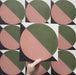 Video showcasing the Geometry Moon 20x20cm geometric patterned tile, highlighting its green and terracotta semicircle design with black and cream corner accents, and demonstrating how the pattern repeats when multiple tiles are laid together.