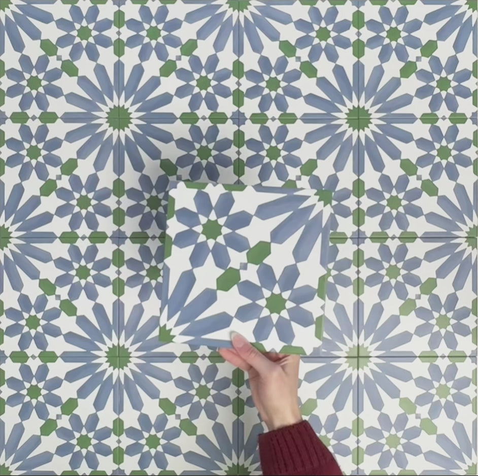 Video showcasing Fizaan Ocean 20x20cm Moroccan-style porcelain tiles, highlighting the repeating geometric pattern and blue, green and white tones in close-up detail.