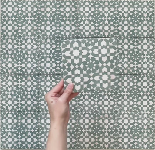 Video showcasing Bedouin Tetuan Green Moroccan-style 15x15cm tiles, highlighting the intricate geometric star and cross pattern in rich green, beige, and white tones. The clip captures the tile’s matte finish, subtle texture, and authentic handcrafted appearance under natural lighting.