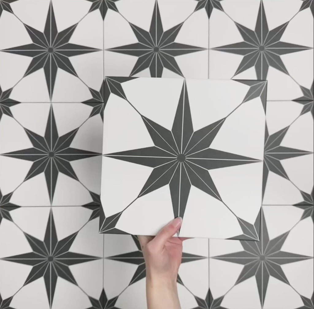 Video showcasing Pole Star Black Moroccan-style 25x25cm patterned porcelain tiles, highlighting the bold black star motif and repeating geometric design.